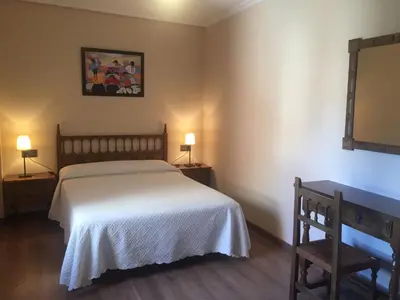 Cama o camas de una habitación en Hostal Argentino