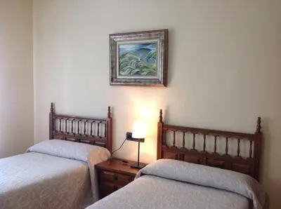 Cama o camas de una habitación en Hostal Argentino