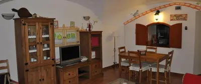 Una televisión o centro de entretenimiento en Destino Deluxe Plaza de Santiago - 3 hab