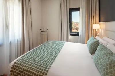 Cama o camas de una habitación en Catalonia Plaza Mayor Salamanca