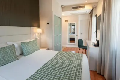 Cama o camas de una habitación en Catalonia Plaza Mayor Salamanca