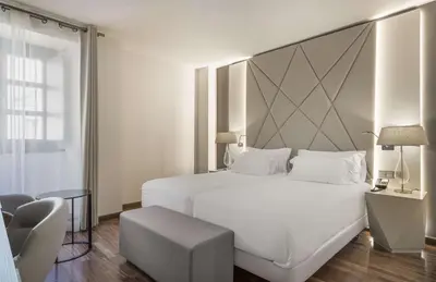 Cama o camas de una habitación en NH Collection Salamanca Palacio de Castellanos