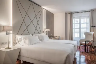 Cama o camas de una habitación en NH Collection Salamanca Palacio de Castellanos