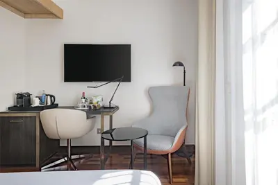 Una televisión o centro de entretenimiento en NH Collection Salamanca Palacio de Castellanos
