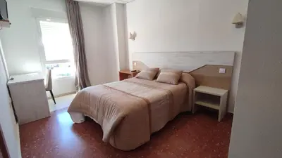 Cama o camas de una habitación en Hotel Peña Cruz