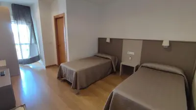 Cama o camas de una habitación en Hotel Peña Cruz