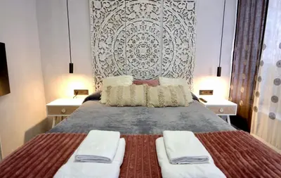 Cama o camas de una habitación en Apartamentos De la Haya & Suite con Jacuzzi, junto al Teatro Romano