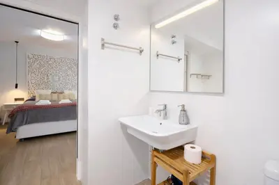 Cama o camas de una habitación en Apartamentos De la Haya & Suite con Jacuzzi, junto al Teatro Romano