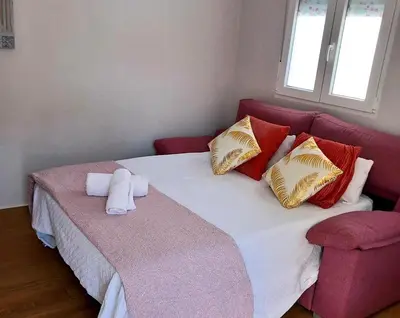 Cama o camas de una habitación en Apartamento De la Haya, junto al Teatro Romano
