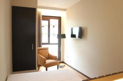 Cama o camas de una habitación en Hotel Alcántara