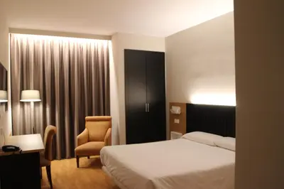 Cama o camas de una habitación en Hotel Alcántara