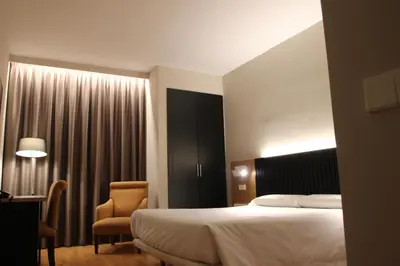 Cama o camas de una habitación en Hotel Alcántara