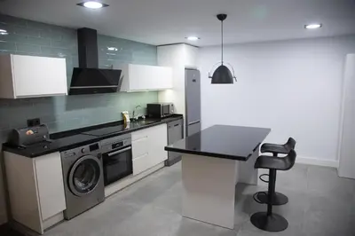 Una cocina o zona de cocina en Apartamentos Boutique Cervantes