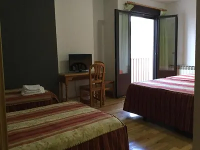 Cama o camas de una habitación en Hotel Cinco Castaños