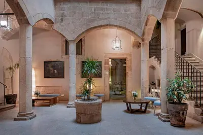 Zona de estar de NH Collection Cáceres Palacio de Oquendo