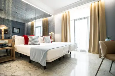 Cama o camas de una habitación en AZZ Mérida Medea Hotel