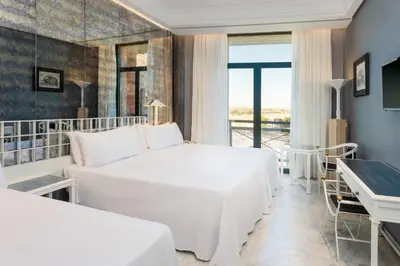 Cama o camas de una habitación en AZZ Mérida Medea Hotel