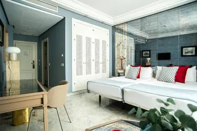 Cama o camas de una habitación en AZZ Mérida Medea Hotel
