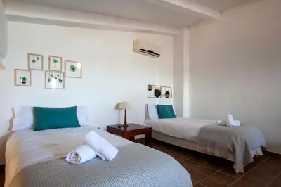 Cama o camas de una habitación en Apartamentos Turísticos Lobelia Suites