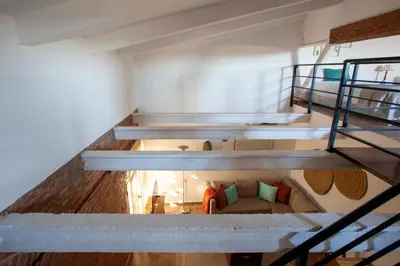 Cama o camas de una habitación en Apartamentos Turísticos Lobelia Suites