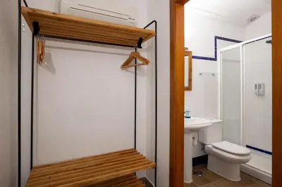 Un baño de Apartamentos Turísticos Lobelia Suites