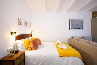 Cama o camas de una habitación en Apartamentos Turísticos Lobelia Suites