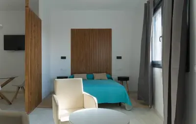 Cama o camas de una habitación en Apartamentos EL SOHO INDUSTRIAL