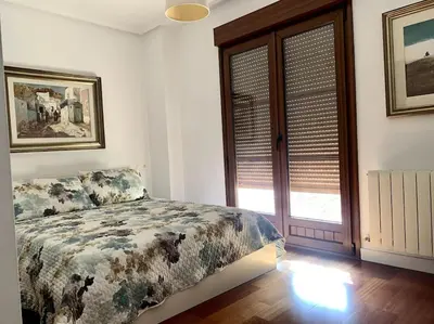 Cama o camas de una habitación en Lotus (garaje y wifi)