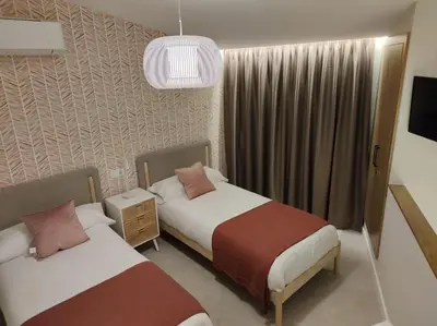 Cama o camas de una habitación en Casa Emilia Cáceres AT-CC-00704