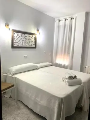 Cama o camas de una habitación en Hostal Casa López