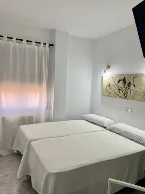 Cama o camas de una habitación en Hostal Casa López