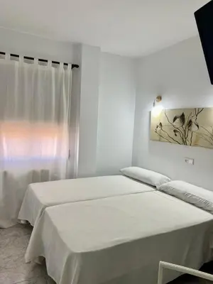 Cama o camas de una habitación en Hostal Casa López