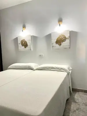 Cama o camas de una habitación en Hostal Casa López