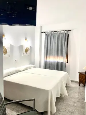 Cama o camas de una habitación en Hostal Casa López