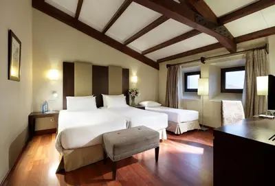 Cama o camas de una habitación en Eurostars Palacio de Santa Marta