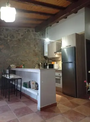 Una cocina o zona de cocina en Casa Rural El Turuterro