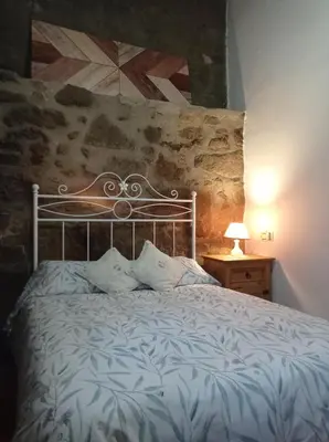 Cama o camas de una habitación en Casa Rural El Turuterro
