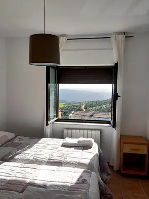 Cama o camas de una habitación en Casa rural Las Peñas