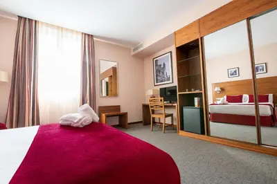 Cama o camas de una habitación en Hospedium Hotel Casino Del Tormes