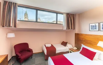 Cama o camas de una habitación en Hospedium Hotel Casino Del Tormes