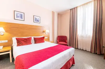 Cama o camas de una habitación en Hospedium Hotel Casino Del Tormes
