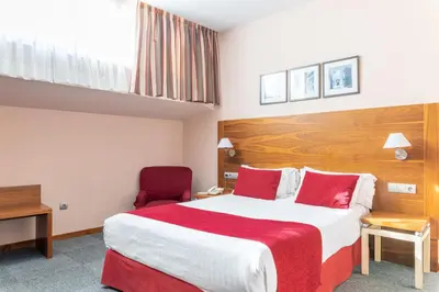 Cama o camas de una habitación en Hospedium Hotel Casino Del Tormes