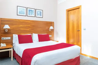 Cama o camas de una habitación en Hospedium Hotel Casino Del Tormes