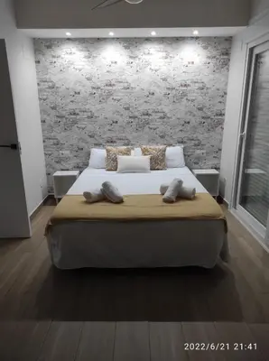 Cama o camas de una habitación en Bonita y amplia casa con patio, en centro ciudad