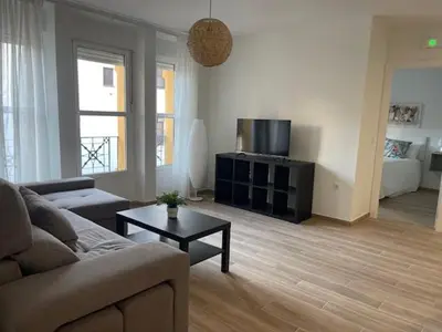 Una televisión o centro de entretenimiento en Apartamentos Turísticos LOS BARRUECOS