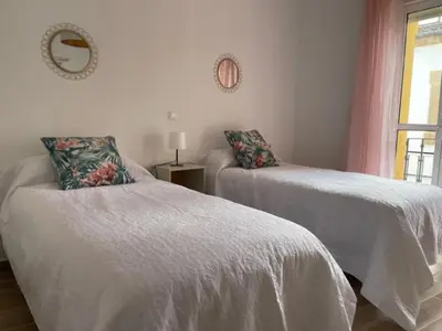 Cama o camas de una habitación en Apartamentos Turísticos LOS BARRUECOS
