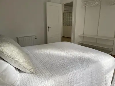 Cama o camas de una habitación en Apartamentos Turísticos LOS BARRUECOS