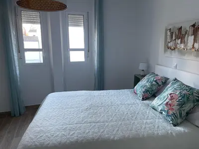 Cama o camas de una habitación en Apartamentos Turísticos LOS BARRUECOS