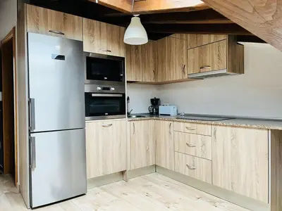 Una cocina o zona de cocina en Apartamentos Raíces
