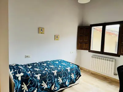 Cama o camas de una habitación en Apartamentos Raíces